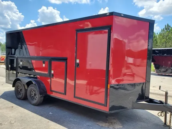 Red and black concession trailer with serving windows and a side door